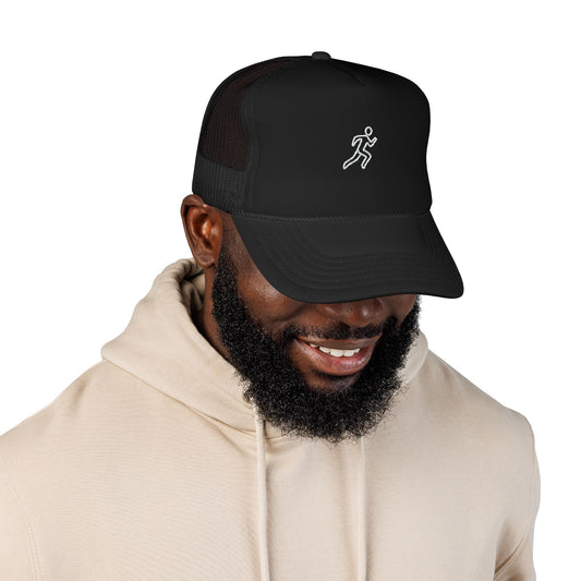 Embroidered Running Icon Trucker Hat in Black worn by model — mesh-back running cap