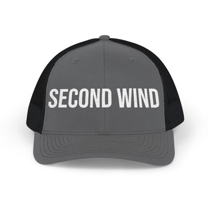 Second Wind embroidered front panel detail - flat thread trucker cap close-up