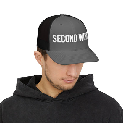 Second Wind Trucker Cap in Charcoal/Black worn by model — embroidered snapback hat