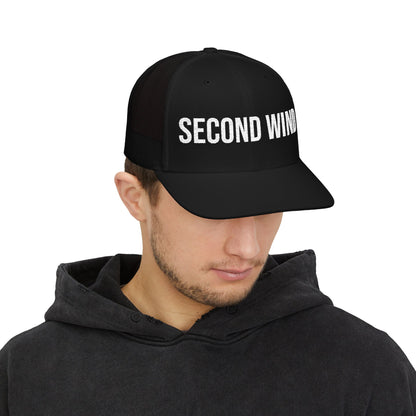 Second Wind Trucker Cap in Black worn by model — embroidered mesh-back snapback hat