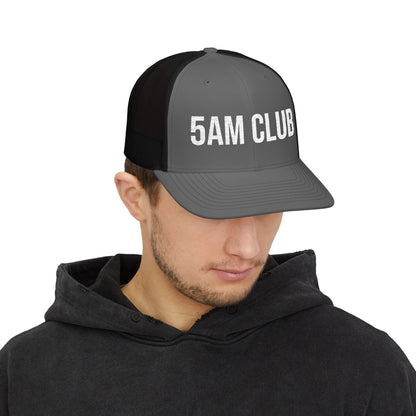 5AM Club Trucker Cap in Charcoal/Black worn by model — embroidered mesh-back snapback