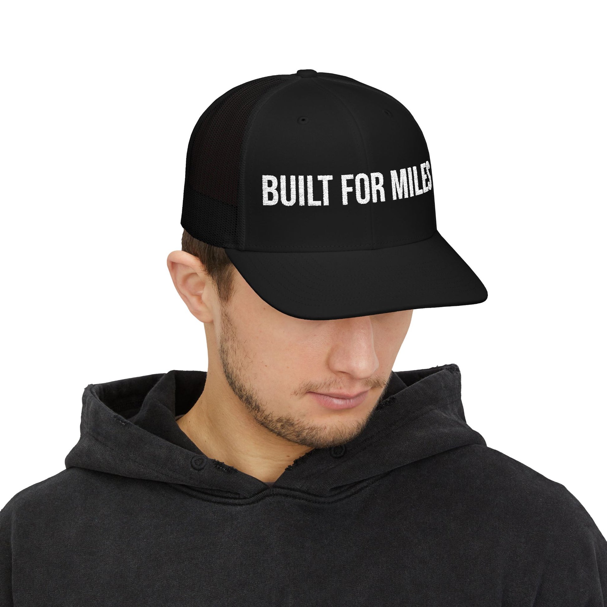 Built For Miles Trucker Cap in Black worn by model — embroidered snapback hat for drivers